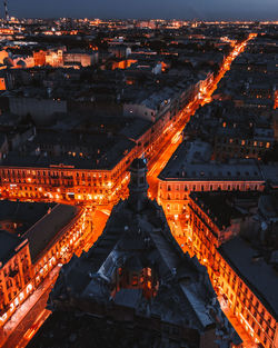 High angle view of illuminated buildings in city at night