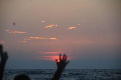 Scenic view of sea at sunset