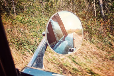 Reflection of car on side-view mirror