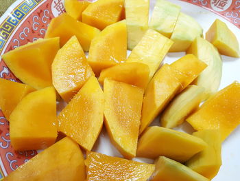 High angle view of chopped fruits in plate