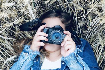 Portrait of woman photographing