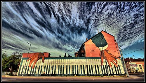 Built structure against cloudy sky