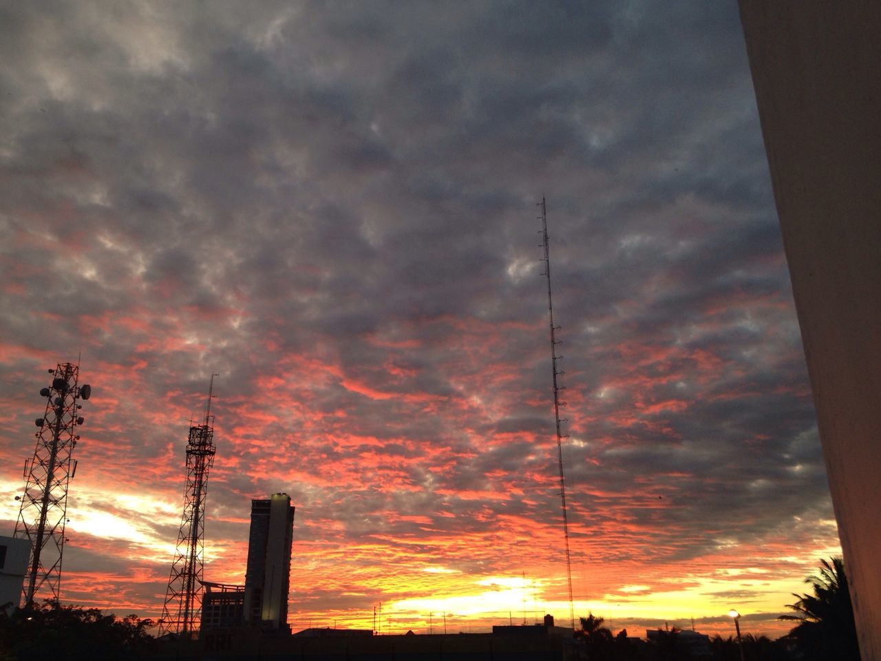 sunset, silhouette, sky, orange color, cloud - sky, low angle view, electricity pylon, dramatic sky, power line, cloudy, beauty in nature, scenics, nature, cloud, power supply, connection, tranquility, weather, moody sky, tranquil scene