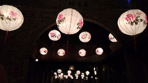 Low angle view of lanterns hanging in row
