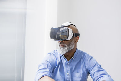 Businessman using virtual reality glasses