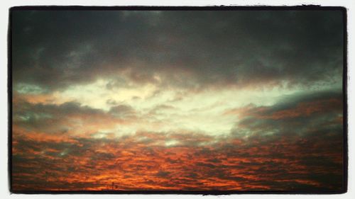 Low angle view of cloudy sky at sunset