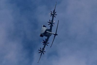 Low angle view of airplane flying in sky