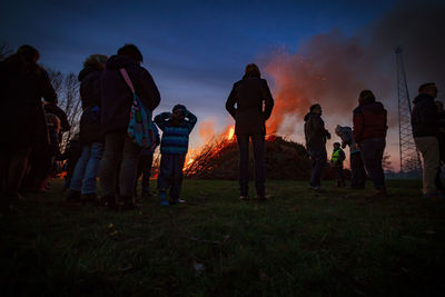 Low angle view of people by bonfire during easter celebration