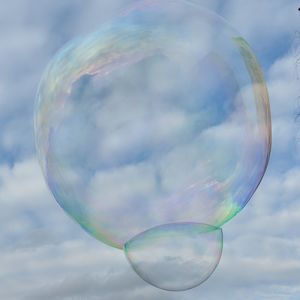 Bubbles in mid-air against sky