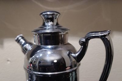 Close-up of drink on metal