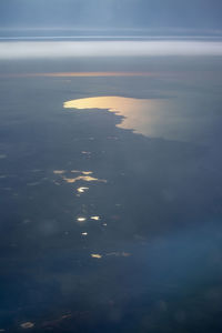 High angle view of sea at sunset