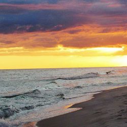 Scenic view of sea against dramatic sky