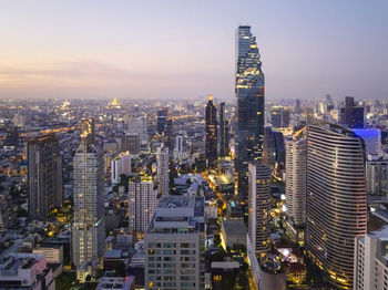 Modern cityscape of business district at sunset