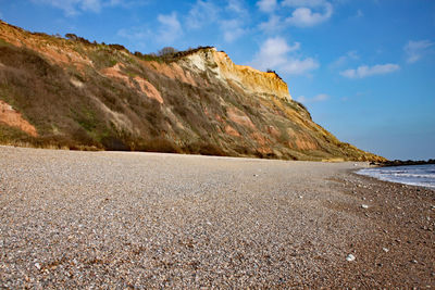 Scenic view of sea and mountains against sky