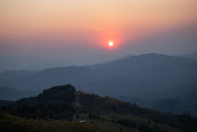 Scenic view of mountains against sky during sunset