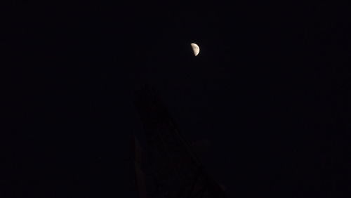 Low angle view of moon against sky at night