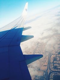 Aerial view of airplane flying in sky