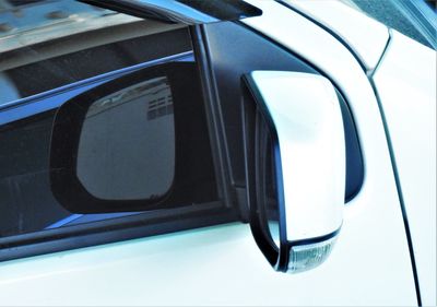 High angle view of reflection on side-view mirror