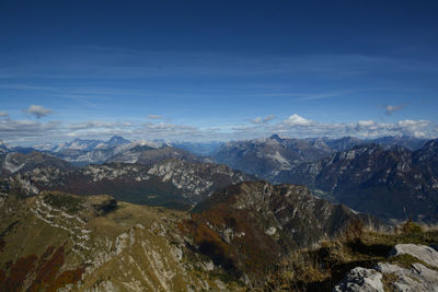 Scenic view of mountains against blue sky