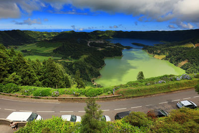 High angle view of trees and sea against sky