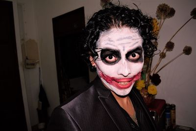 Close-up portrait of man wearing hallowwen face paint