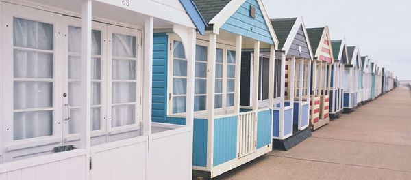 View of beach huts against sky