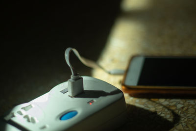 Close-up of smart phone on table
