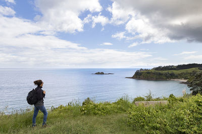 Man on sea against sky