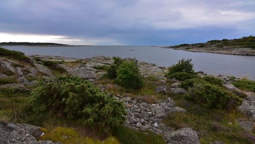 Scenic view of sea against cloudy sky