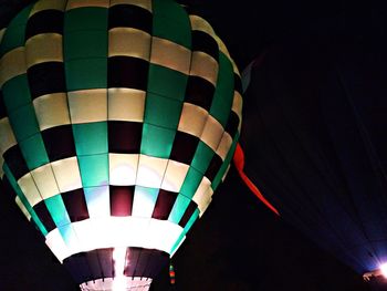 Low angle view of hot air balloon at night