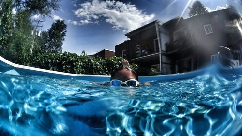 View of swimming pool against blue sky