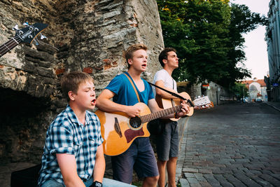 Full length of a man playing guitar