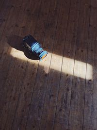 High angle view of umbrella on hardwood floor