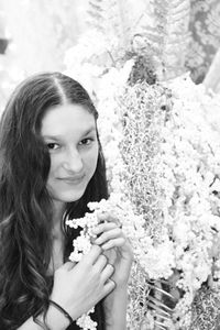 Portrait of young woman holding ice cream