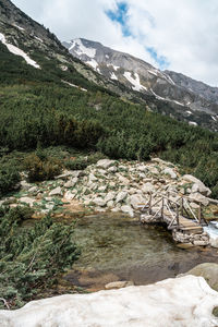 Landscape with wooden bridge over river in pirin mountain near okoto lake, bulgaria