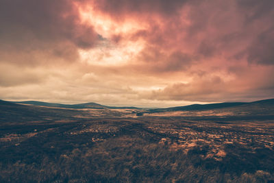 Scenic view of landscape against sky during sunset