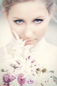 Portrait of woman holding flower