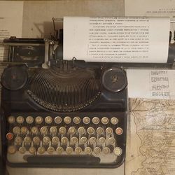 Close-up of old telephone booth on table