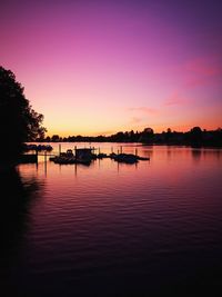 Scenic view of lake against romantic sky at sunset