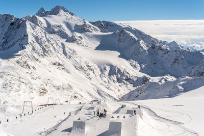 Scenic view of snowcapped mountains against sky