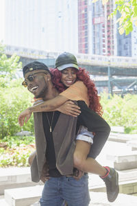 A couple in a music group spending time together in a park