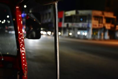 Close-up of car on road at night