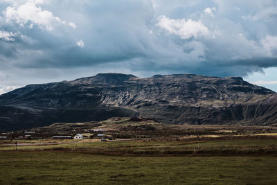 Scenic view of landscape and mountains against sky