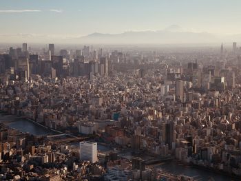 High angle view of modern buildings in city against sky