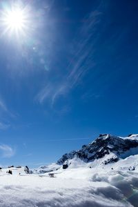 Scenic view of snow covered mountain against sky