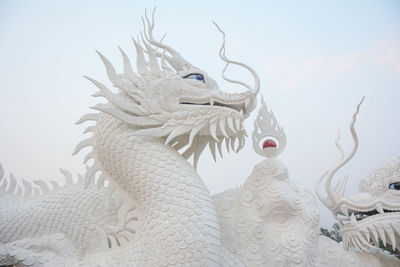 White chinese dragon decorated on a chinese dragon sculpture design background