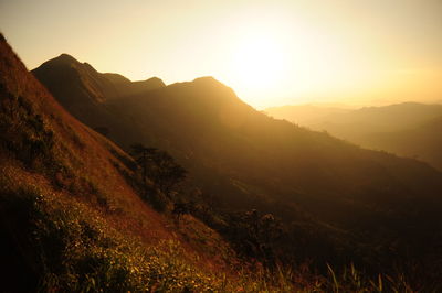 Scenic view of mountains against sky during sunset