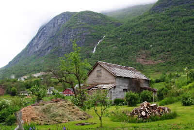 Scenic view of trees and houses on mountain