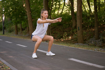 Full length of woman on road