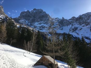 Scenic view of snow covered mountains against sky